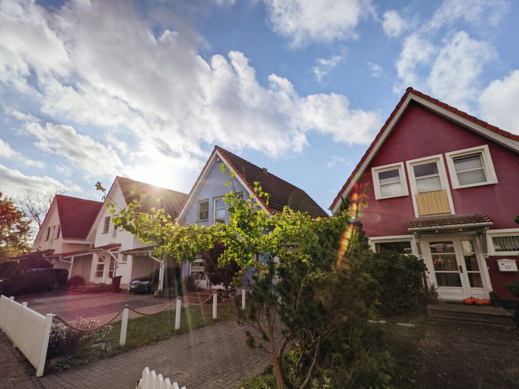 A row of colorful homes under a brilliant blue sky.
